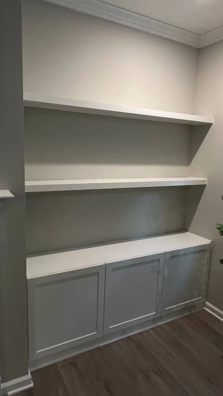 A selection of interior carpentry work, including built-in storage, closet systems, window trim and a fireplace feature wall. Custom details turn everyday spaces into useful parts of the home.